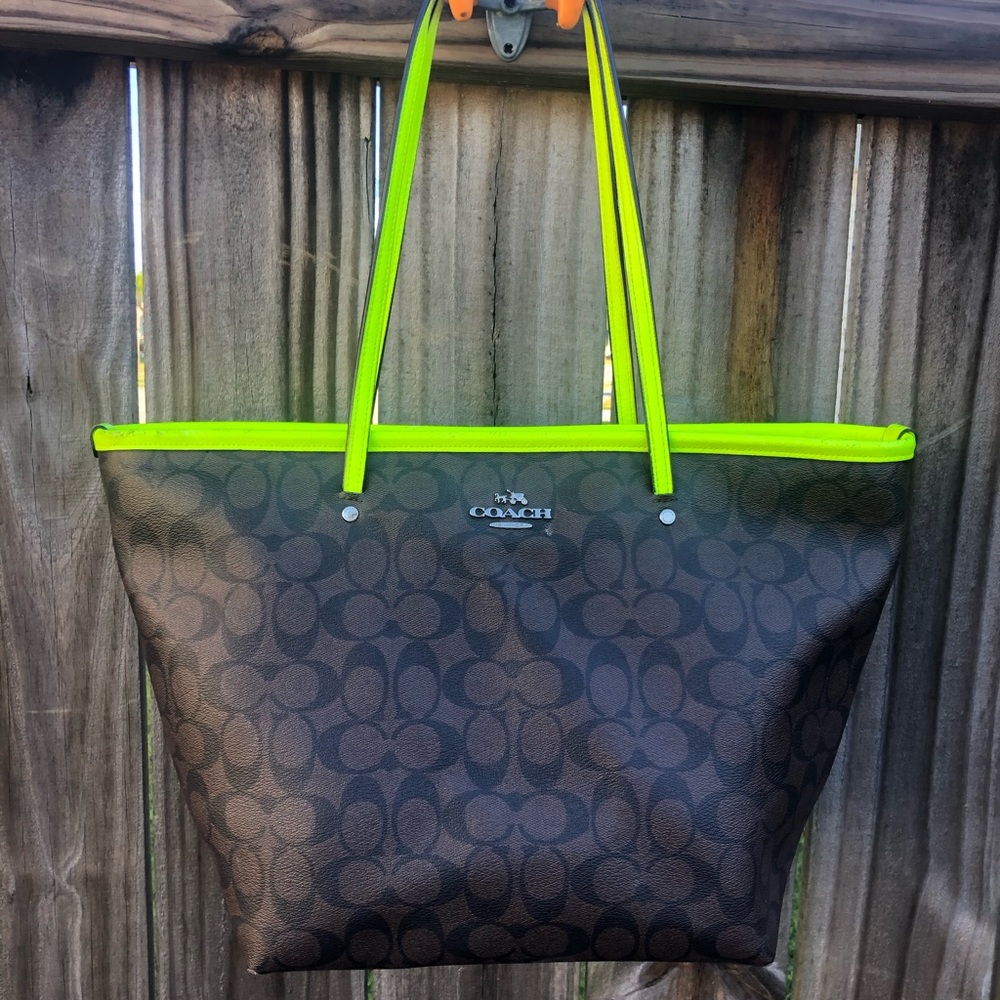 Dark brown and neon green Coach purse